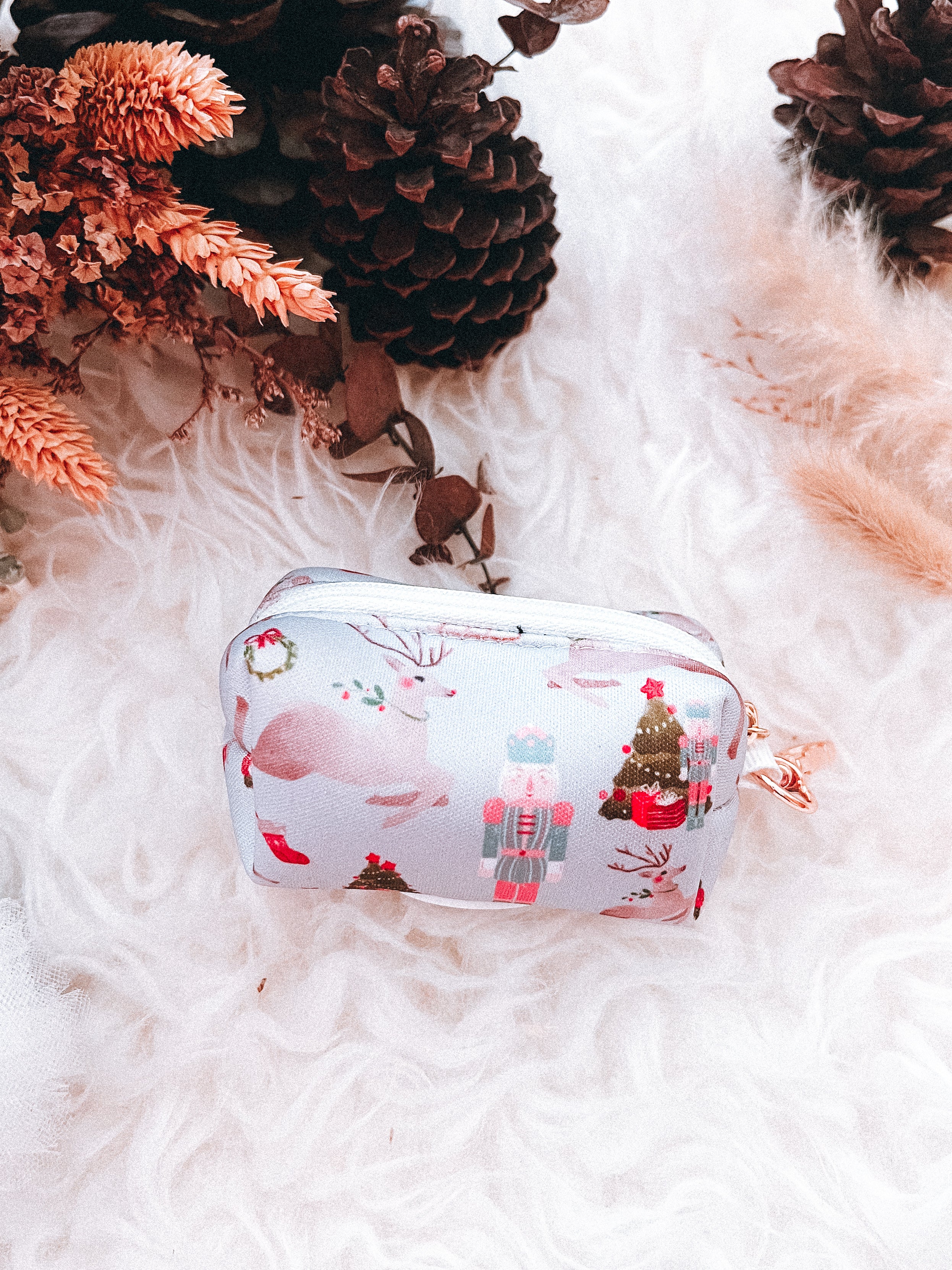 Neoprene poop bag holder with nutcrackers and reindeer prints for dog walks