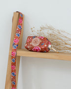 Scarlet Batik Poop Bag Holder – dog poop bag holder in a red batik-inspired print